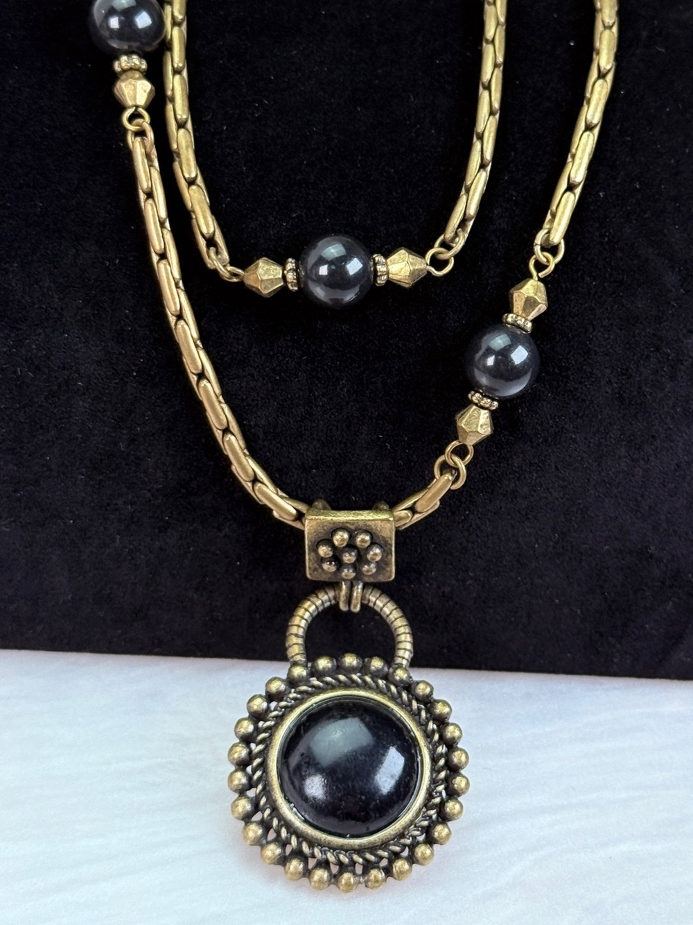 Beautiful long costume Brasstone and black layering necklace